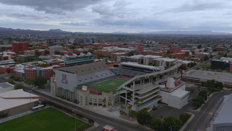 Wide-View-Of-The-Football-Stadium-Of-The-University-Of-Arizona-In-Tucson,-AZ---aerial-panning-shot