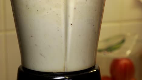 Close-up-of-food-blender-with-ingredients-being-mixed-together