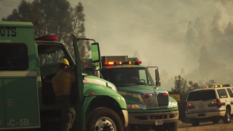 American-fire-fighters-arriving-at-disaster-area-with-wildfire-smoke-in-background