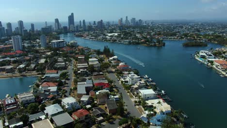Aerial-drone-footage-of-Surfers-Paradise-panning-downwards-looking-towards-Broadbeach-revealing-main-canal