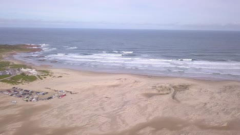 Aerial-pan-across-beautiful-white-sand-Anna-Bay-and-Stockton-Beach-sand-dunes-at-Birubi-Beach