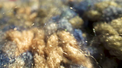 Detailed-macro-close-up-of-gold-and-blue-wool-material
