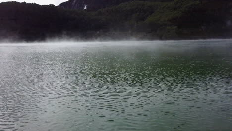 Aerial-shot-of-steaming-lake-in-New-Zealand