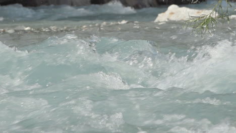Detail-shot-in-slowmotion-of-how-the-water-falls-in-the-Venosc-river,-Les-Deux-Alpes