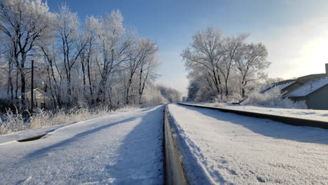 Pretty-scenic-train-tracks-filled-with-snow-in-winter