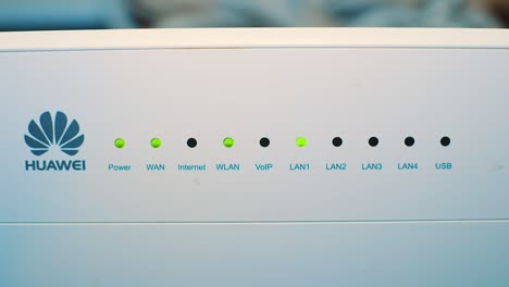 Huawei-Router-With-Flashing-Green-Lights---closeup-shot