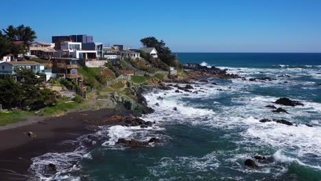 Aerial:-beach-houses-near-the-sea-with-an-incredible-view-in-punta-de-lobos-beach-shot-with-drone-to-have-a-premium-lifestyle-in-chile-colchagua-cardenal-caro