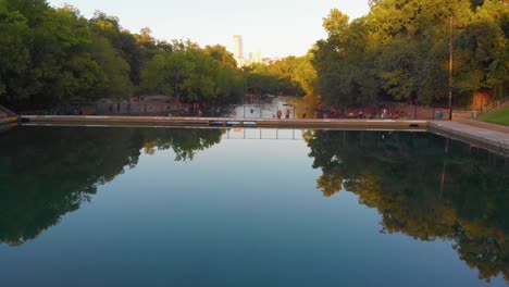 Straight-shot-of-barton-springs-pool-over-to-barking-springs-spillway-towards-downtown-Austin-Texas
