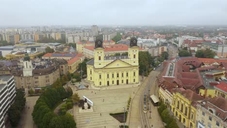 Drone-footage-from-the-Church-at-Debrecen-citys-main-squarein-rainy-weather-autumn-Drone-flies-backwards