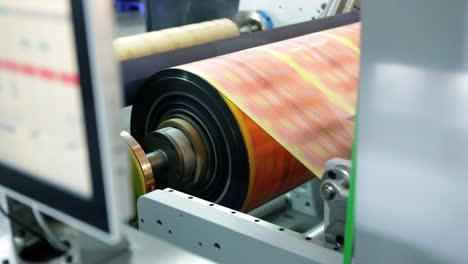 Plastic-sheet-layer-package-rolling-closeup-shot,-industry-paper-rolling,-Plastic-Sheet-printing,-Industrial-Stock-Footage,-Stock-Footage