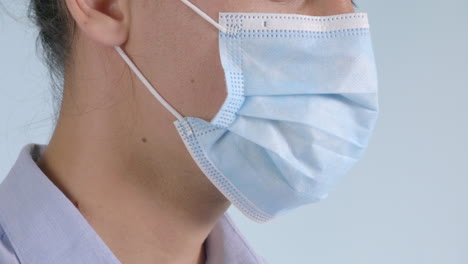 Close-up-portrait-of-a-man-wearing-a-safety-surgical-face-mask