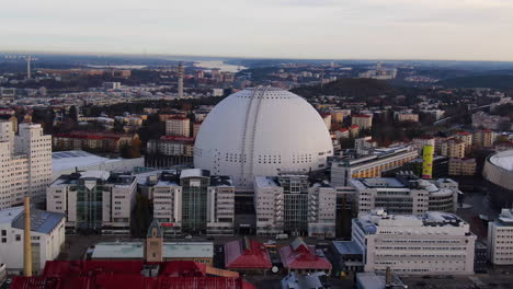 Fall-day-drone-shot-closing-in-on-Ericsson-Globe-while-tilting-down