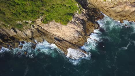 Aerial-top-down-view-descending-on-the-coast-of-the-Trilha-da-Sepultura-in-Brazil