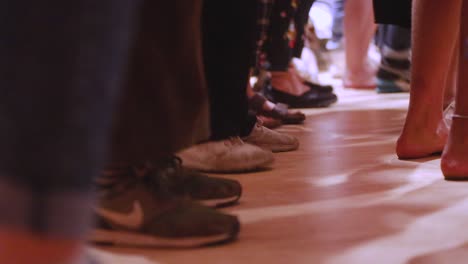 People's-Feet-Stepping-In-Rhythmic-Pattern-On-The-Floor---close-up