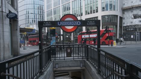Traffic-passes-behind-London-Monument-underground-tube-station-entrance