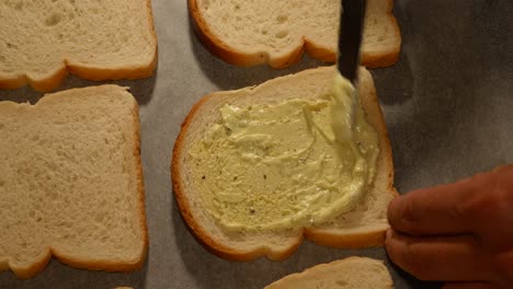 Spreading-mayonnaise-Sauce-on-homemade-student-style-sandwiches