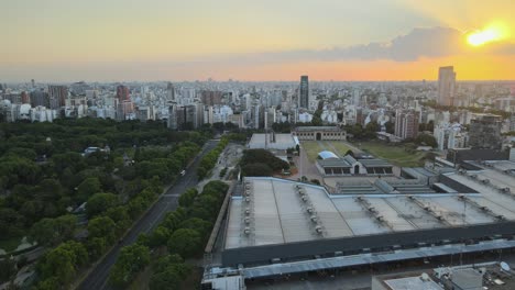 Buenos-Aires-drone-view-orbiting-La-Rural-Exposition-centre-urban-skyline-cityscape-at-sunset