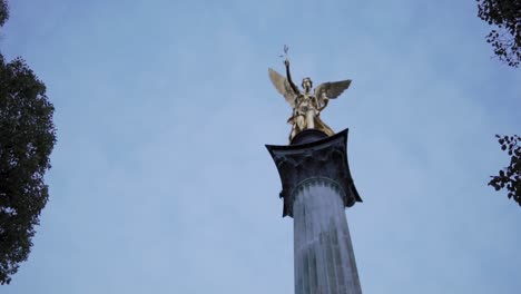 Landmark-of-Munich,-Germany,-Friedensengel-aka-Angel-of-Piece-Sculpture-on-Top-of-Column,-Slow-Motion-Low-Angle-View
