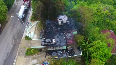 Aerial-view-around-a-burnt-down-house-fire,-in-rural-Mexico---circling,-drone-shot