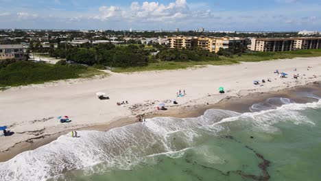 Touristic-Cocoa-Beach-in-Florida-with-People-on-Summer-Vacation,-Aerial