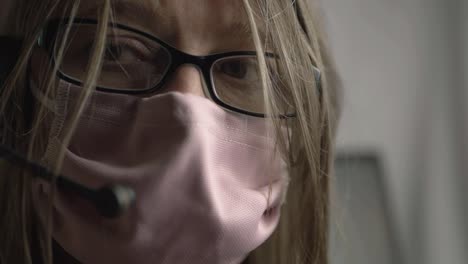 Anxious-woman-wearing-face-mask-and-glasses-portrait-close-up-shot
