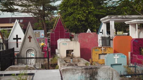 Graves-of-different-shapes-and-colors-in-Christian-cemetery-of-Medan