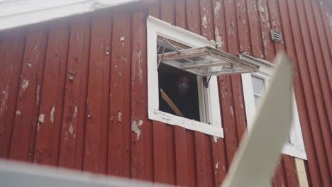 Rioter-in-mask-destroying-furniture-at-Lofoten-Norway