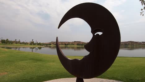 Man-in-the-moon-is-part-of-the-public-art-which-abounds-at-Fountain-Park,-Fountain-Hills,-Arizona