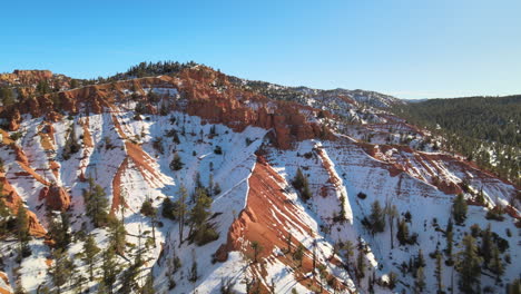 Aerial-views-of-snow-covered-sandstone-formations-of-the-Red-Canyon-and-the-Dixie-National-Forest-near-Bryce-Canyon-National-Park,-Utah