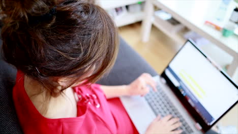 High-Angle-View-Of-A-Lady-Touching-Screen-Of-A-Laptop---selective-focus