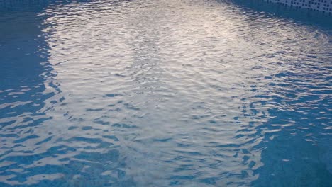The-water-swirling-on-the-surface-of-a-swimming-pool