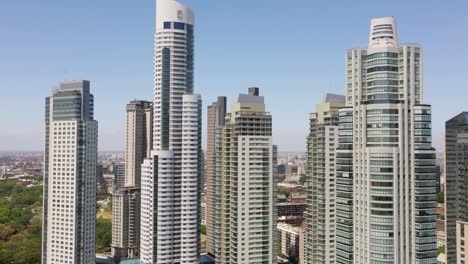 Aerial-parallax-shot-of-high-rise-buildings-in-Puerto-Madero-waterfront,-Buenos-Aires
