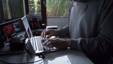 Male-in-home-office-setting.-Typing-on-computer