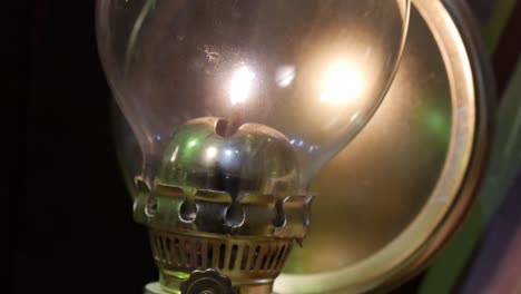 Close-up-tilt-up-over-an-antique-oil-lamp