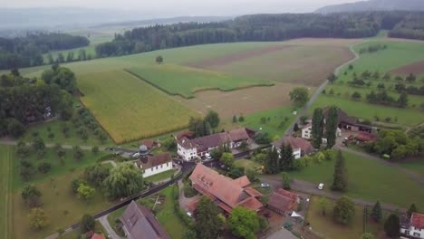 Drone-shot-of-a-small-village-on-a-hill-called-Hörhausen-in-Switzerland