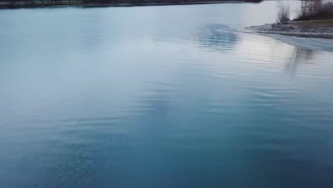 The-drone-turns-fast-around-over-a-lake-in-Switzerland