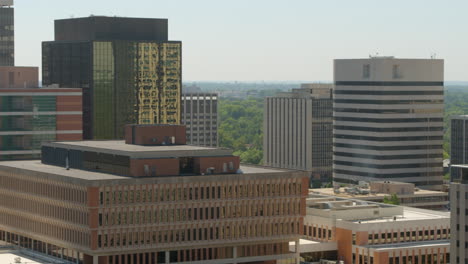 Aerial-midlevel-view-of-downtown-city-with-a-pan-showing-skyline