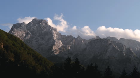 Time-lapse-clouds-over-mountain-peak-in-sunset,-Ojstrica-in-Kamnisko-Savinjske-Alpe,-Slovenia,-Logarska-dolina,-European-Alps