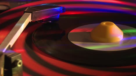 45-RPM-vinyl-record-spinning-on-a-turntable-with-flashing-lights