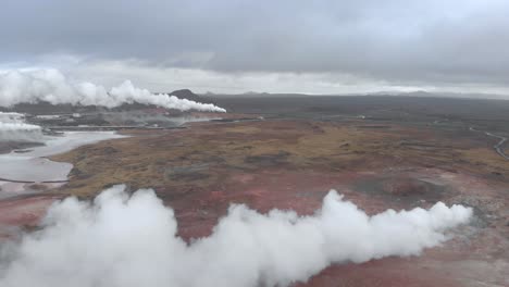 Aerial-shot-of-a-bleak-and-barren-landscape-above-a-geothermal-hot-spring