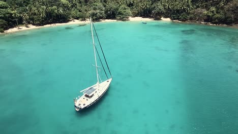 Drone-footage-of-a-sail-boat-at-one-of-Panama's-islands-"Playa-Blanca"-located-at-Colon-province