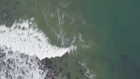 Dramatic-aerial-of-surfing-along-coast-in-South-Africa