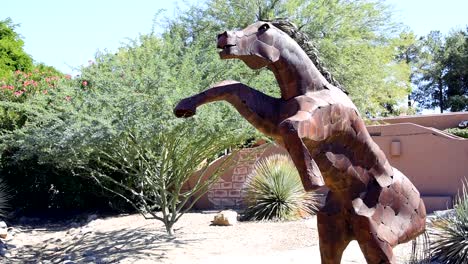 Sculpture-of-a-large-metal-horse-on-hind-legs-profile-view-medium-shot
