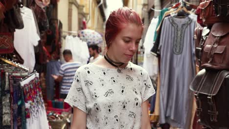 redhead-young-girl-walking-through-a-arabic-market