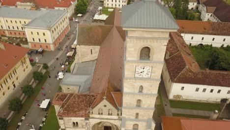 Aerial-Establishing-shot-of-Eastern-European-orthodox-church-with-clock-on-the-front-and-shoting-the-roof-of-the-church