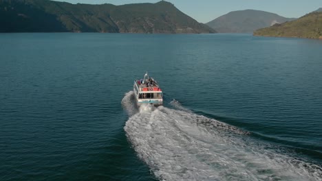 Mail-Boat-Tour-cruising-in-Marlborough-Sounds,-New-Zealand---Aerial-Drone
