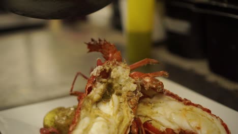 Close-Up---Putting-a-gravy-on-a-cooked-New-Zealand-crayfish