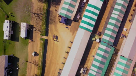 Top-down-aerial-footage-of-the-stables-at-an-equestrian-park