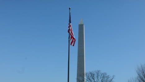 American-Flag-blowing-in-the-wind-with-Washington-monument-in-the-background
