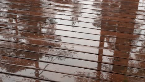 Raindrops-at-terrace,-reflections,-diagonal